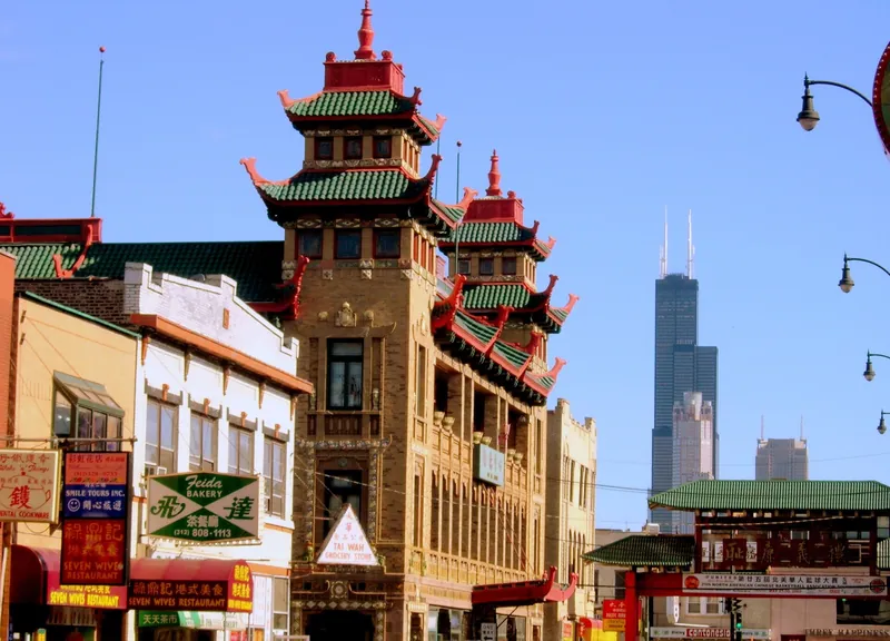Wentworth Avenue shopfronts and the Pui Tak Center tower